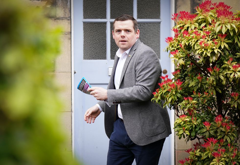Scottish Conservative leader Douglas Ross in Davidson Mains, Edinburgh, on the campaign trail for Scottish Conservatives ahead of the local government elections. Picture date: Wednesday April 13, 2022.