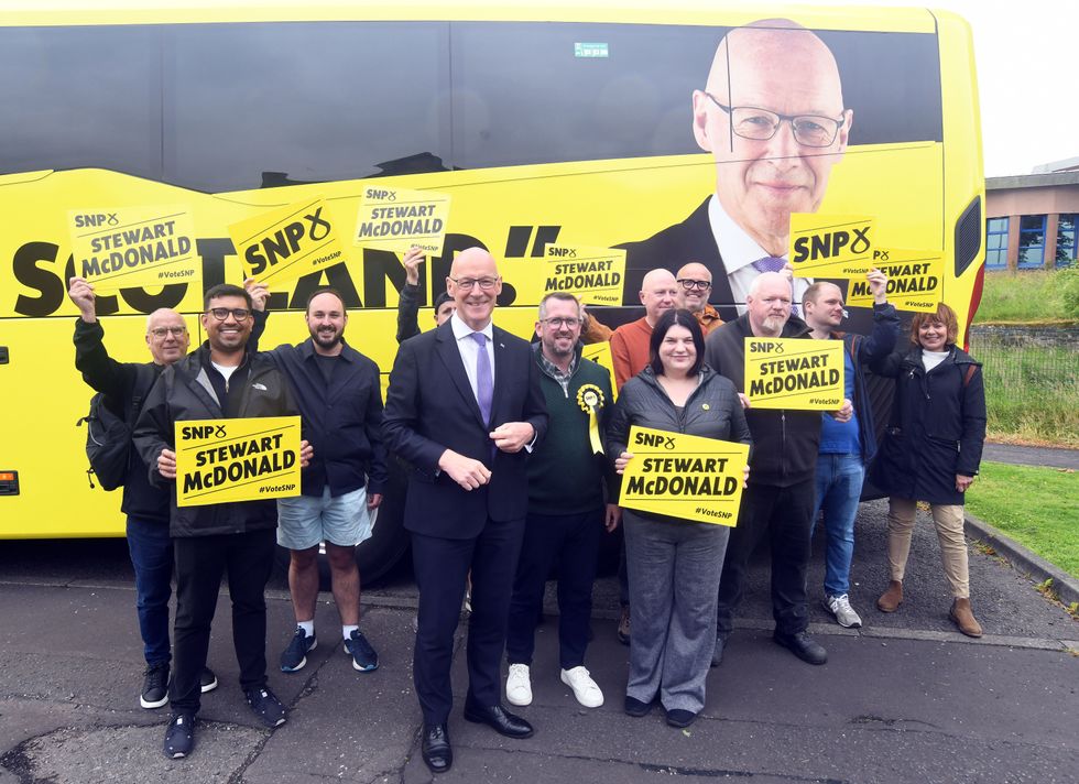 Scottish First Minister and SNP leader John Swinney (centre left) and SNP parliamentary candidate for Glasgow South, Stewart McDonald