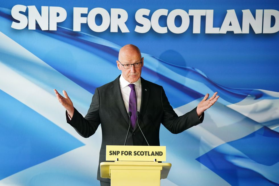 Scottish First Minister John Swinney speaking to the media at The Port of Leith Distillery in Edinburgh