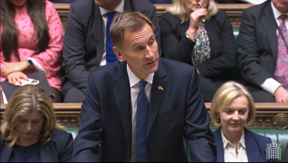 Screen grab of Chancellor of the Exchequer Jeremy Hunt (centre), along side the Leader of the House of Commons Penny Mordaunt (left) and the Prime Minister Liz Truss, speaking in the House of Commons, London. Picture date: Monday October 17, 2022.