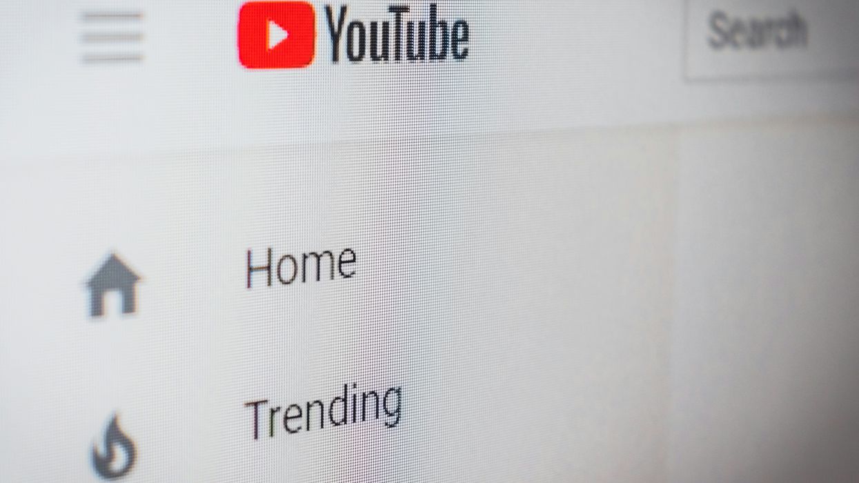 screenshot of the youtube homepage with home trending tabs show next to the youtube logo