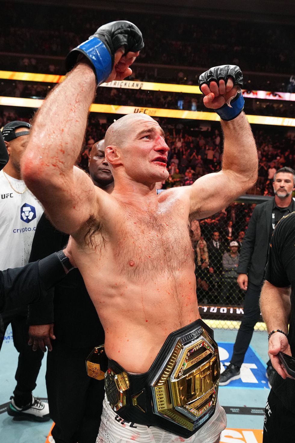 Sean Strickland celebrates his victory at UFC 328