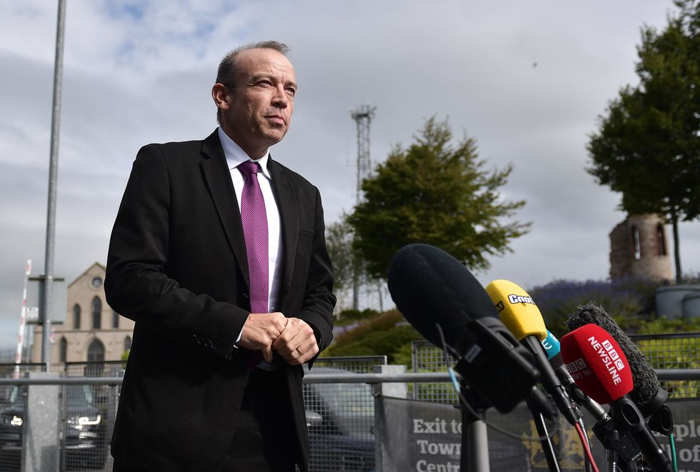 Secretary of State for Northern Ireland Chris Heaton-Harris speaks to the media as he arrives at the Hill of O'Neill Arts Centre