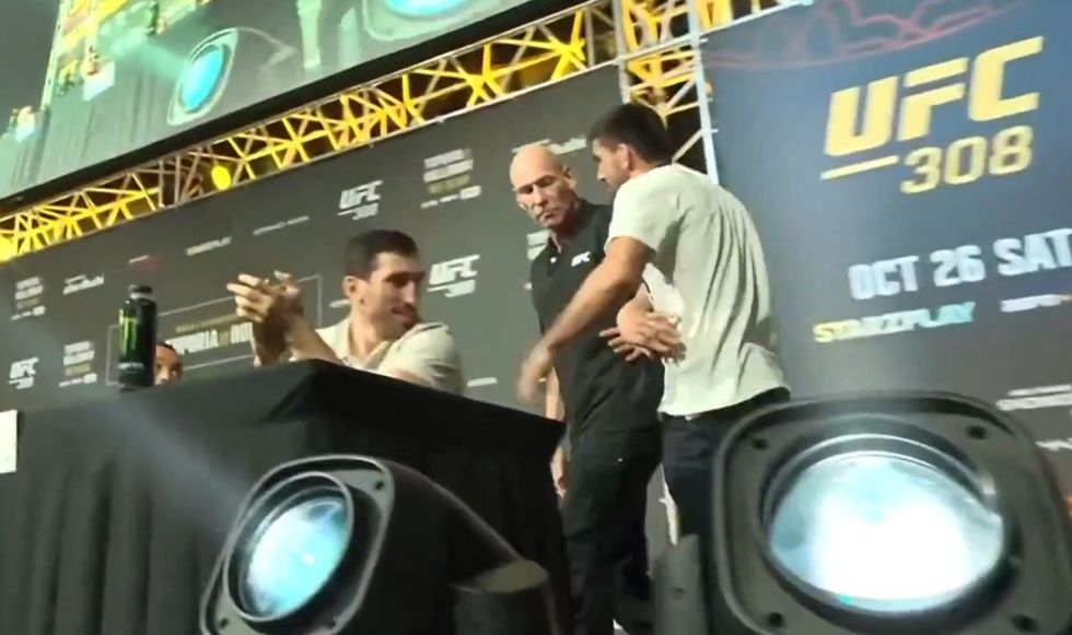 Security briefly tried to stop the unsigned fighter