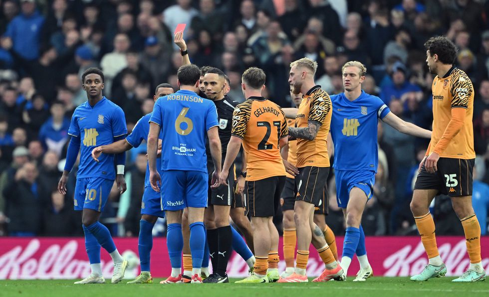 Security staff and officials were forced to intervene to separate the groups as tempers flared in front of a stunned crowd