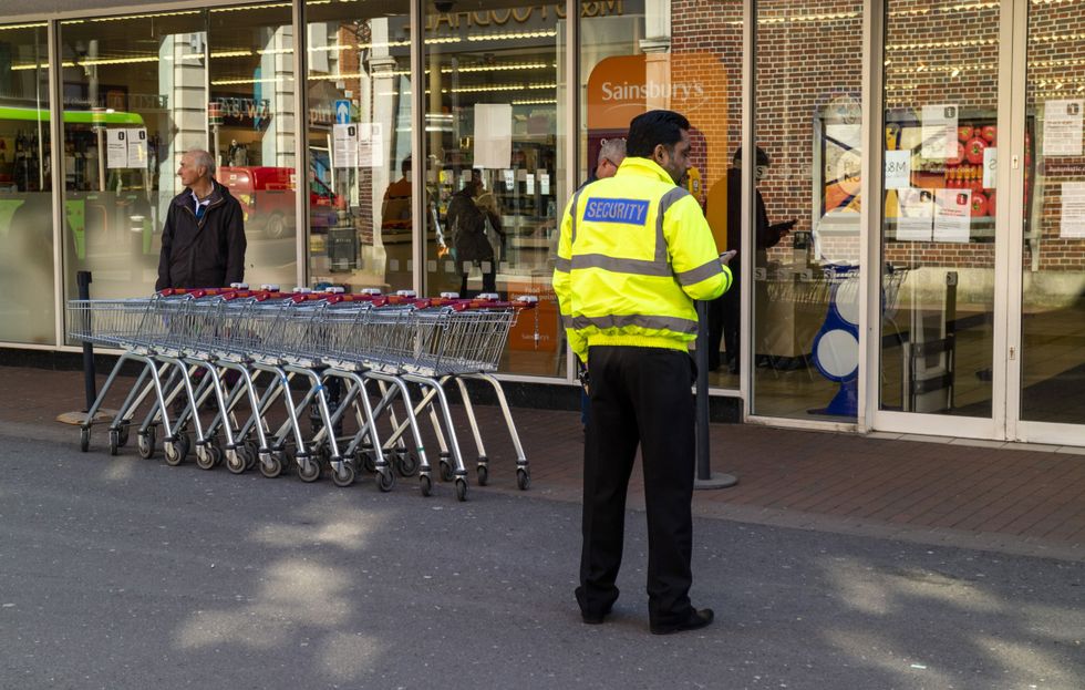 Security worker outside a Sainsbury's