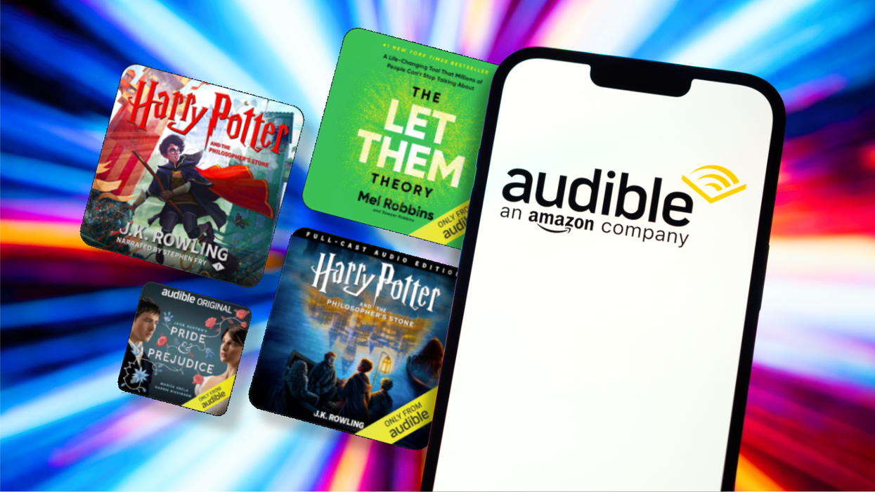 selection of audible titles stacked on a black friday sale banner with an iphone running the audible app in the foreground