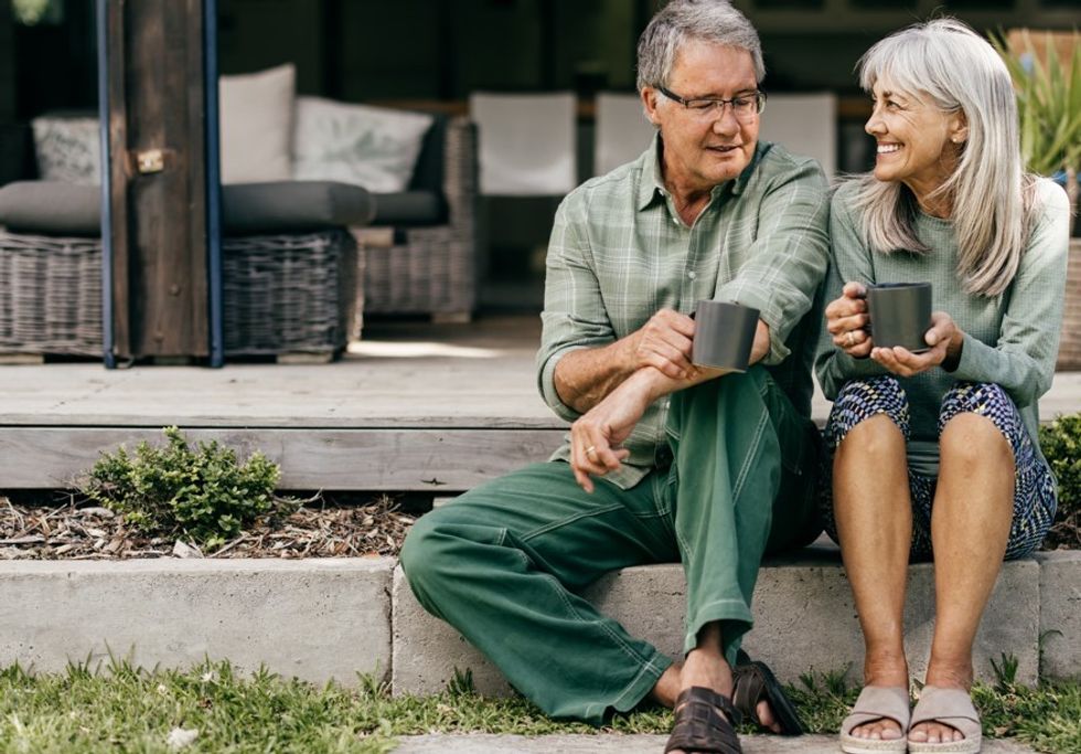 Senior friends sitting on steps
