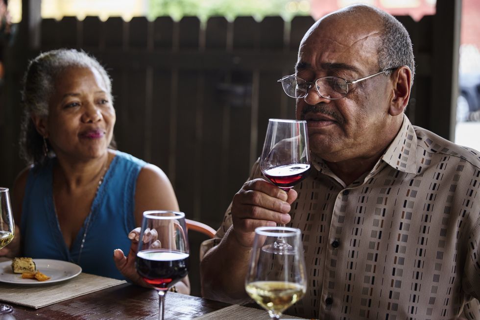 senior man drinking wine