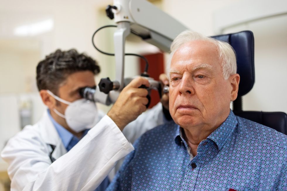 Senior man having his hearing checked