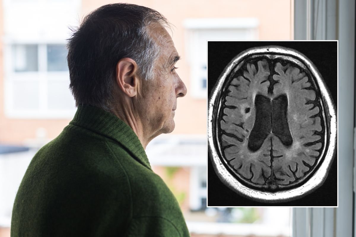 Senior man looking out window