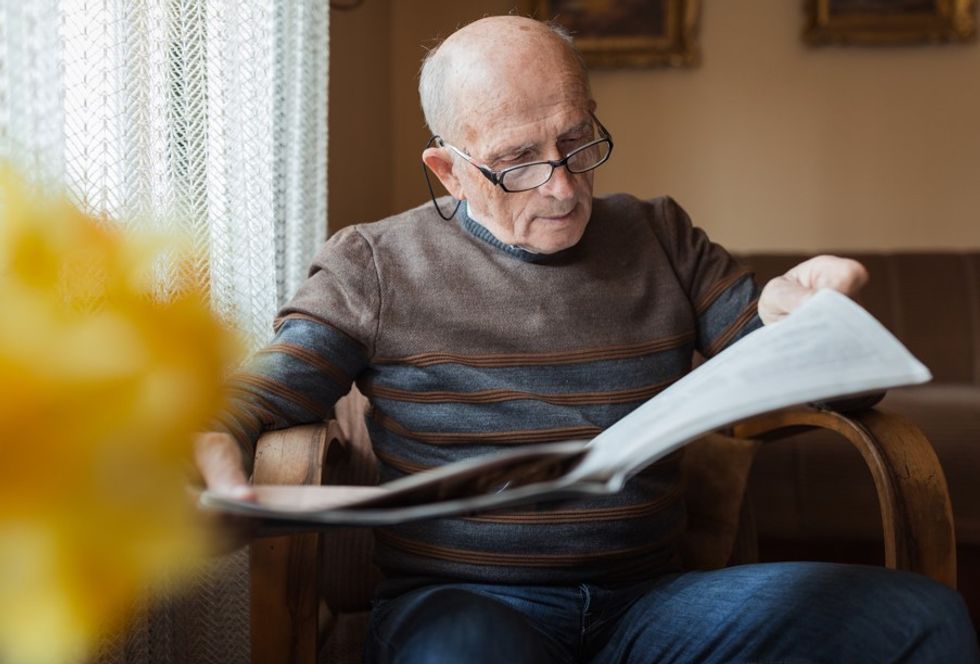 Senior man reading newspaper