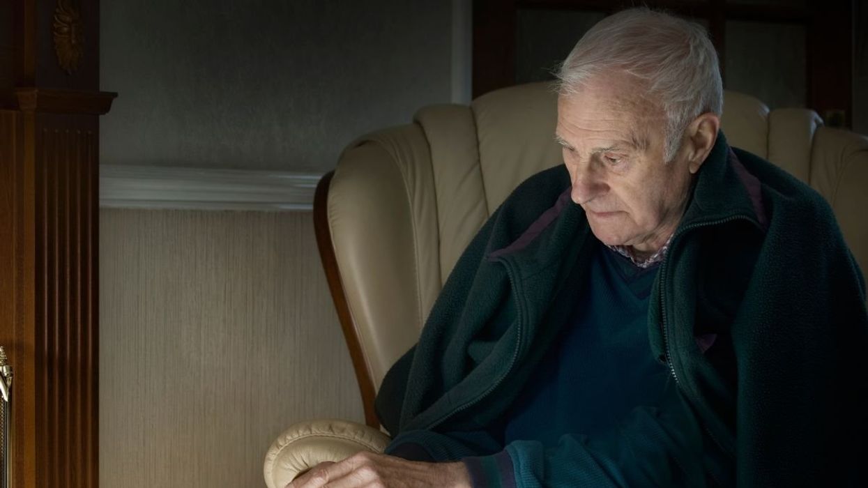 SENIOR MAN WITH WALKING STICK