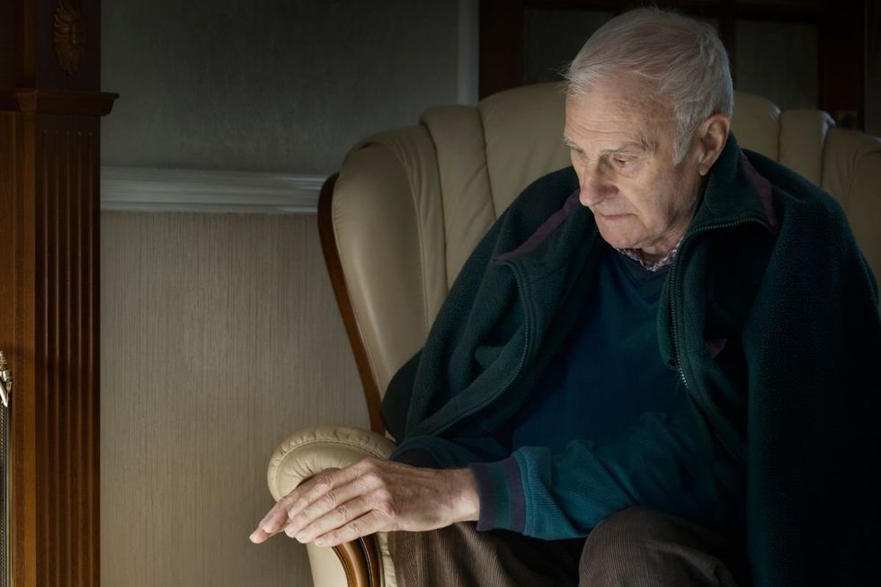 SENIOR MAN WITH WALKING STICK