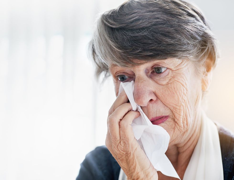 SENIOR WOMAN EYE PAIN