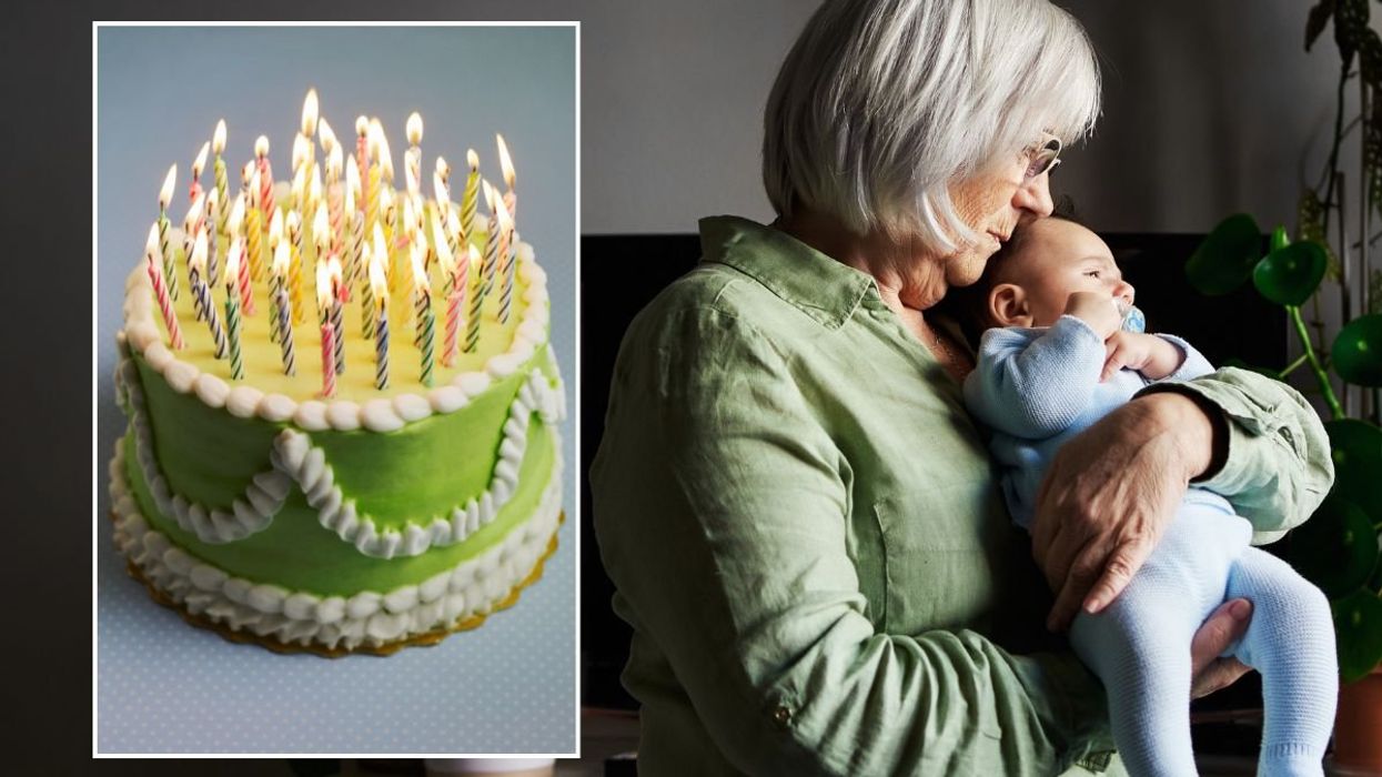 SENIOR WOMAN HOLDING BABY