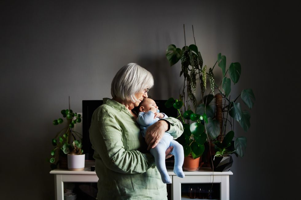Senior woman holding baby