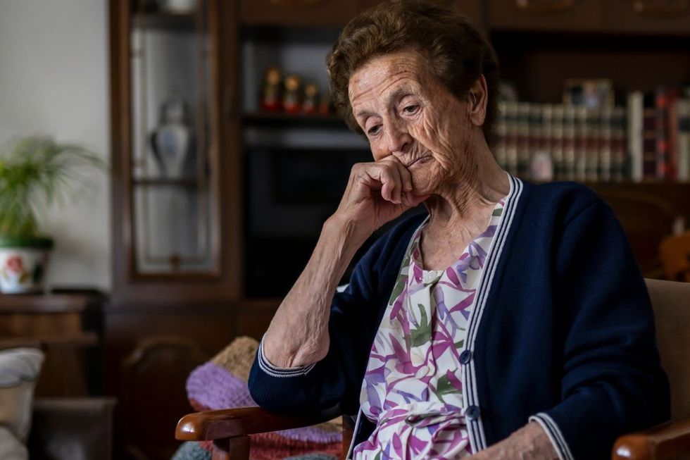 SENIOR WOMAN LOOKING SAD