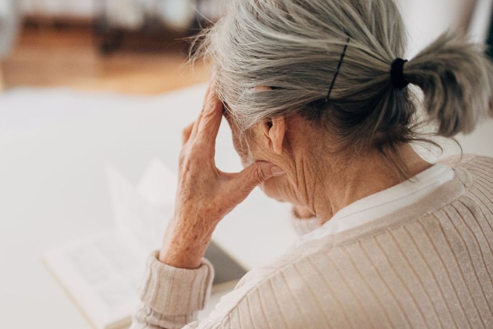 senior woman with headache