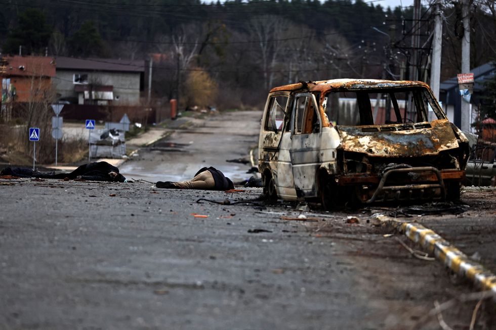 SENSITIVE MATERIAL. THIS IMAGE MAY OFFEND OR DISTURB. Bodies of civilians, who according to residents were killed by Russian army soldiers, lie in the street, amid Russia's invasion of Ukraine, in Bucha, in Kyiv region, Ukraine April 2, 2022. Picture taken April 2, 2022. REUTERS/Zohra Bensemra