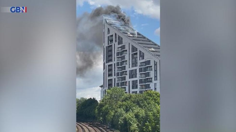 Bromley: 80 firefighters tackle huge blaze at block of flats as smoke plumes engulf the sky