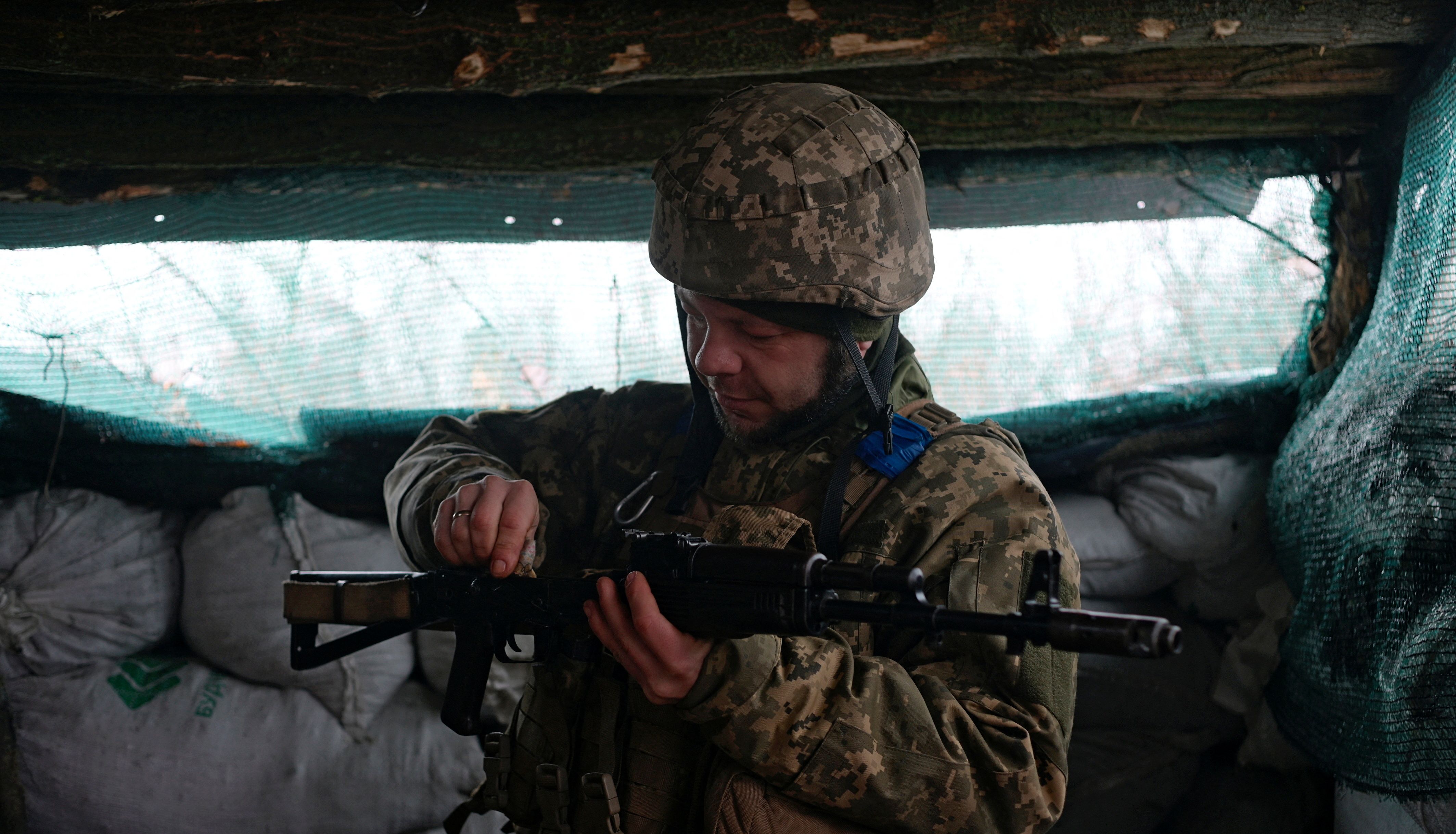 Service member of the Ukrainian armed forces Kolya, known by the nom de guerre Boroda (Beard), is seen at combat positions near the line of separation from Russian-backed rebels outside the town of Popasna in Luhansk Region.