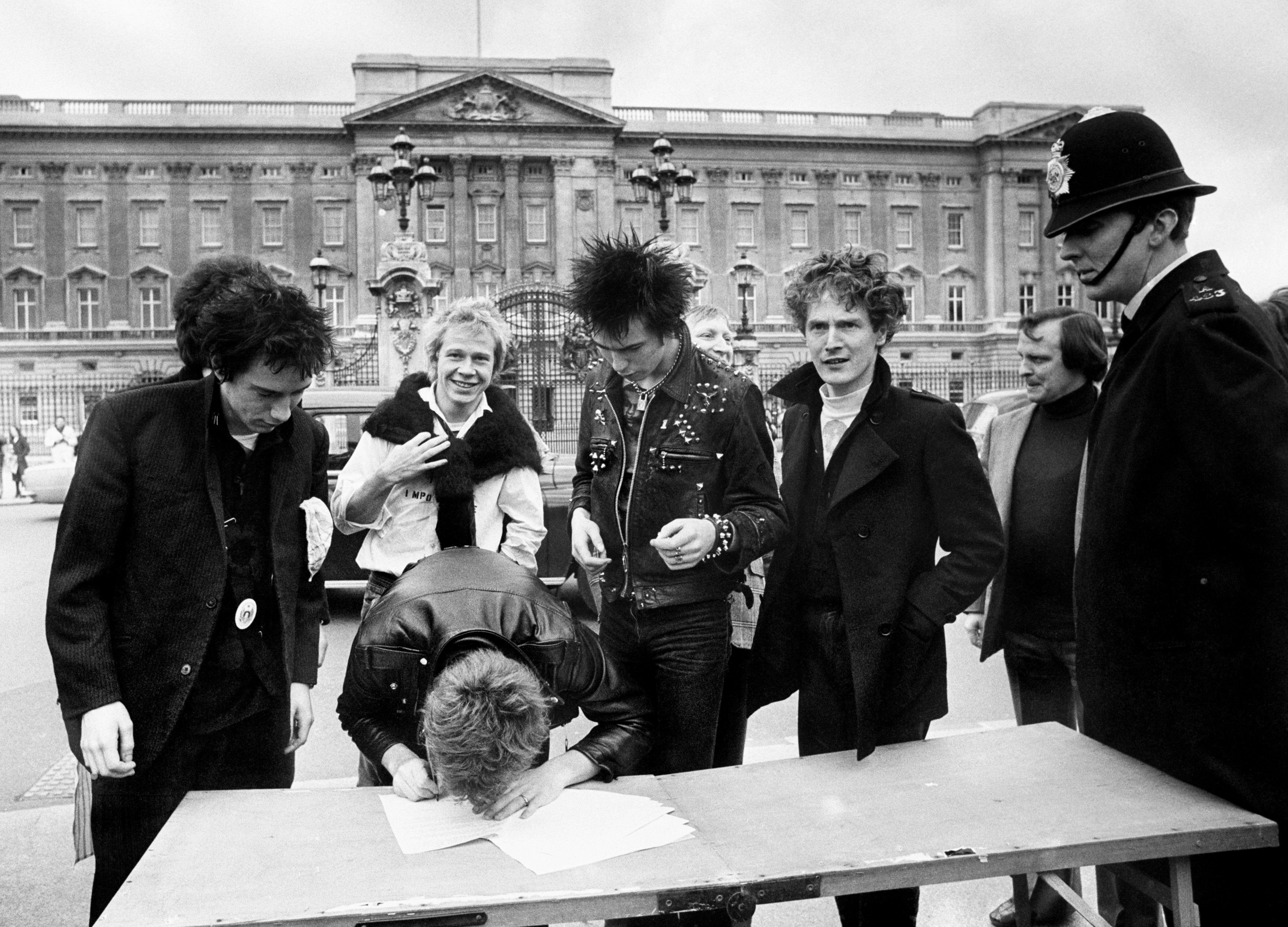 Sex Pistols signing a recording contract with A&M Records outside Buckingham Palace in London.