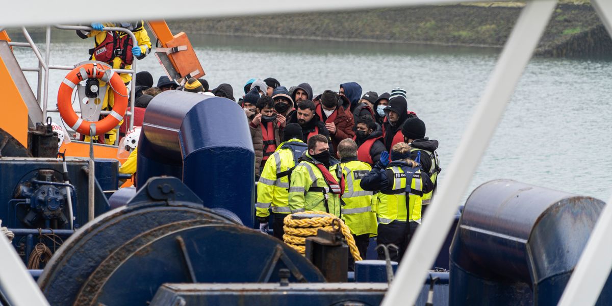 NextImg:Britain faces 'ticking clock' as MILLIONS of migrants to be handed indefinite leave to remain in just months
