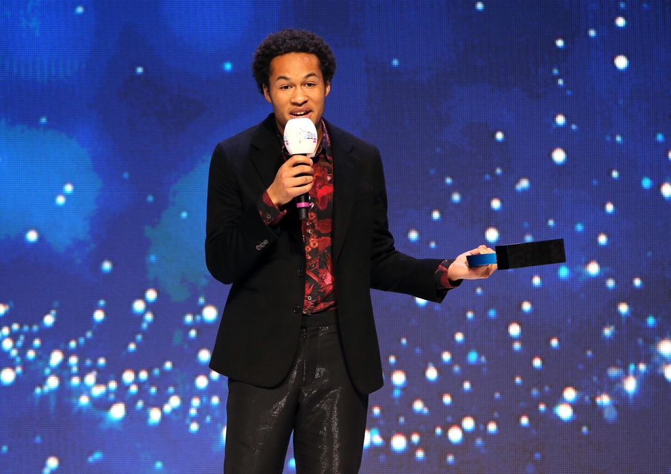 Sheku Kanneh-Mason accepts the award for Best Classical Artist on stage at the Global Awards 2020