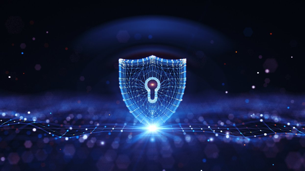 Shield symbol with blue digital background