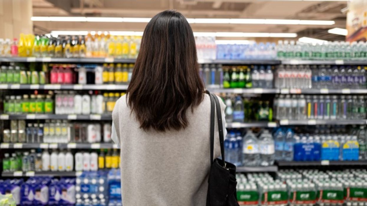 Shopper standing in aisle