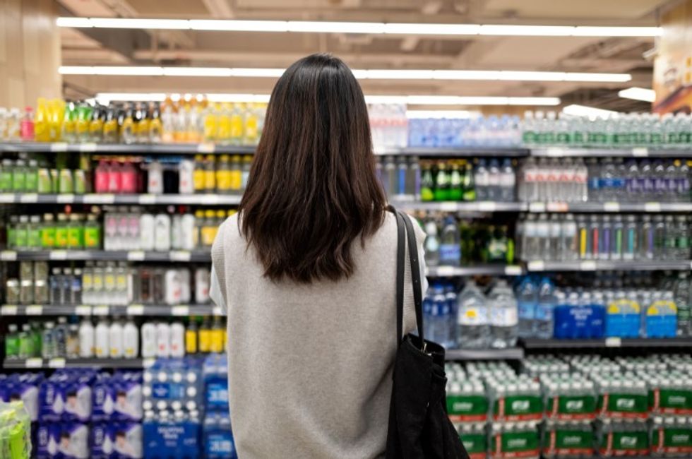 shopper standing in aisle