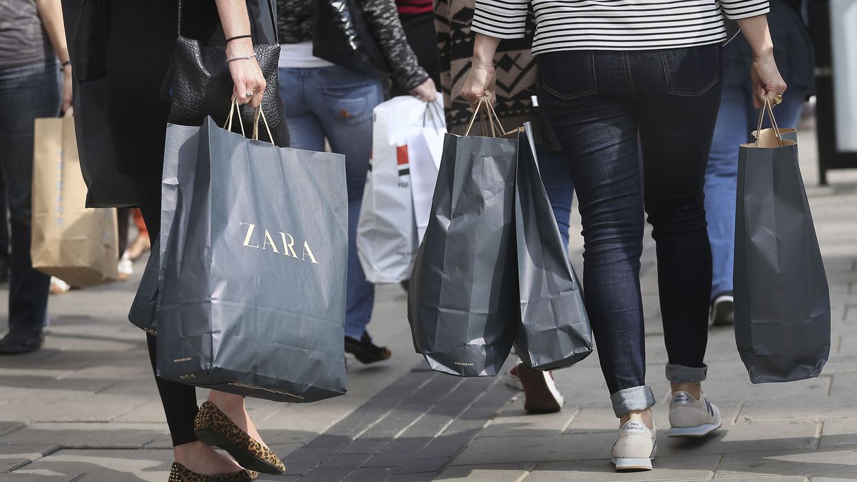 Shoppers holding bags on high street