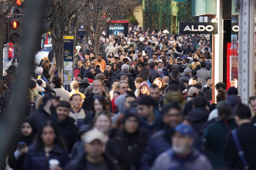 Shoppers on London's Oxford Street during the Boxing Day sales. Boxing Day shoppers will be trying particularly hard this year to get the best value for money as everyday bills surge. Picture date: Monday December 26, 2022.