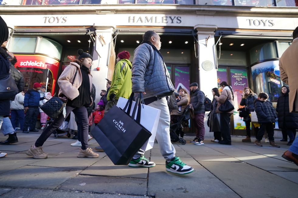 Shoppers outside Hamleys toy store on Regents Street, London, during the Boxing Day sales. Boxing Day shoppers will be trying particularly hard this year to get the best value for money as everyday bills surge. Picture date: Monday December 26, 2022.