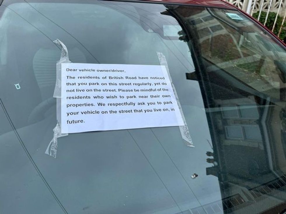 Sign left on a car in Bristol