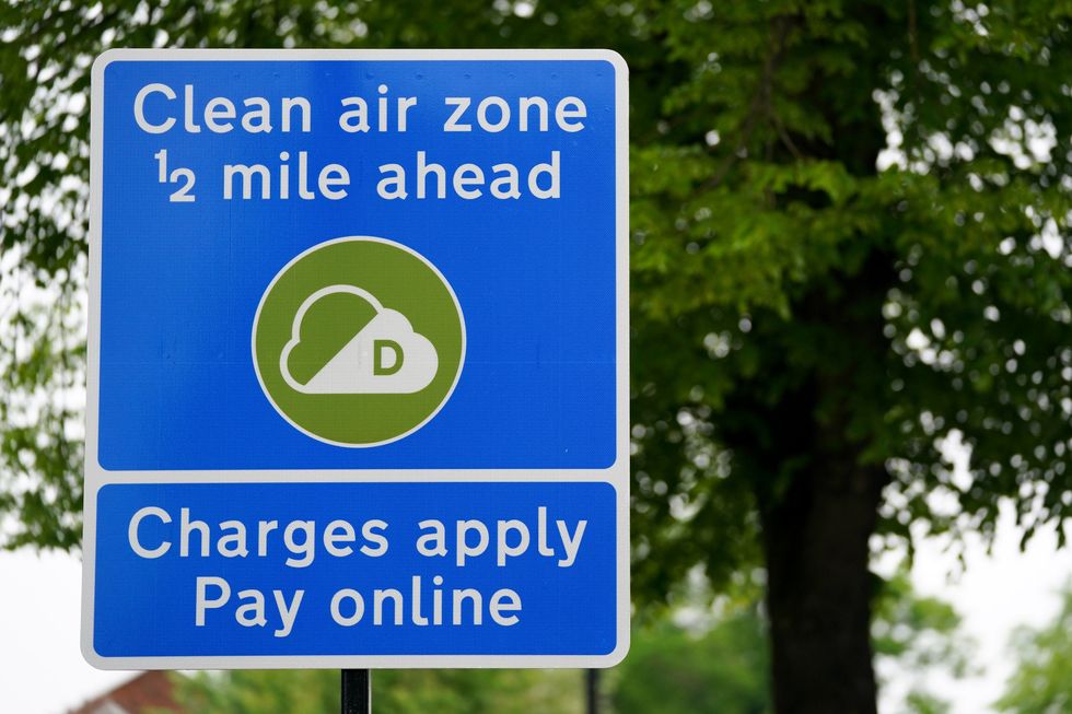 Signs in Birmingham informing road users of the clean air zone initiative