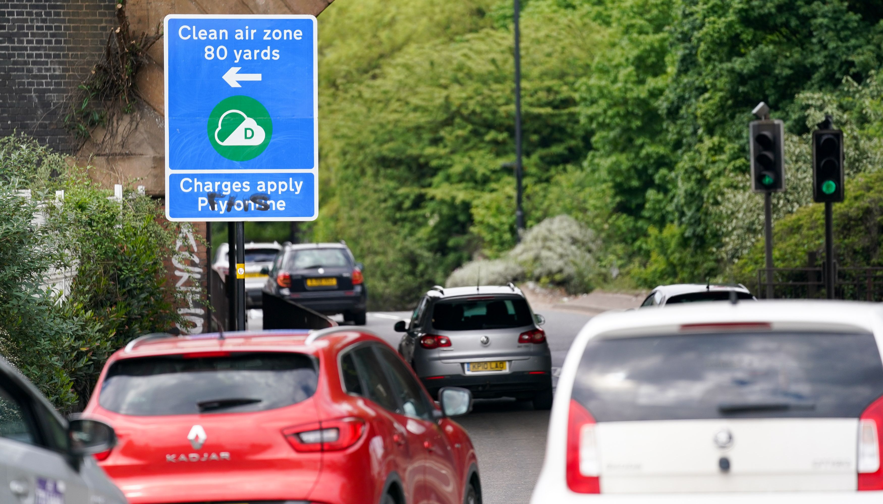 Signs in Birmingham informing road users of the clean air zone initiative