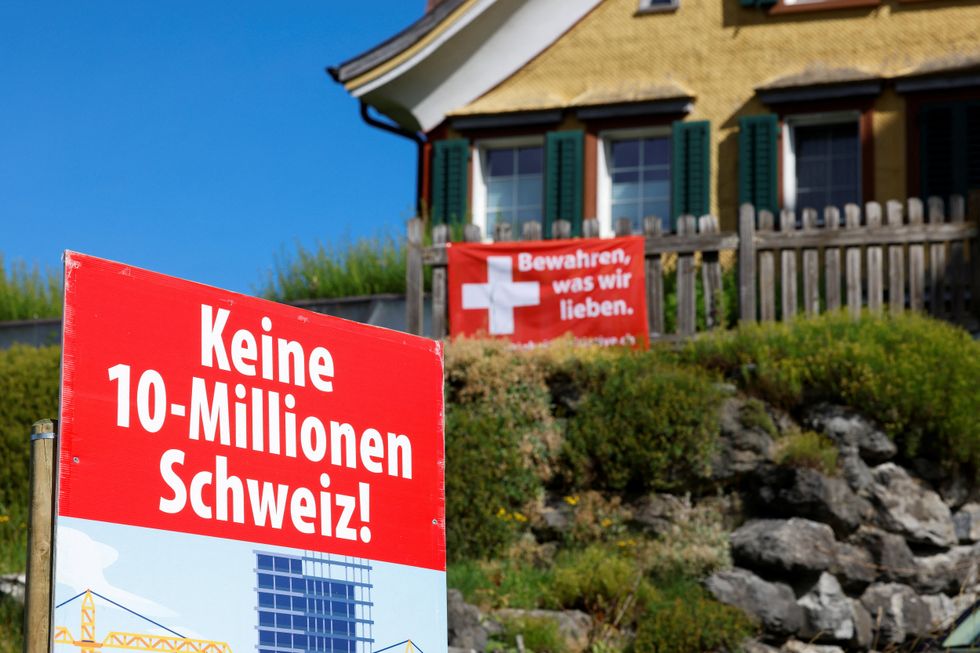 Signs in Switerland telling people about the 10 million population cap referendum