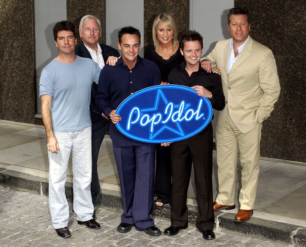 Simon Cowell alongside his Pop Idol co-stars