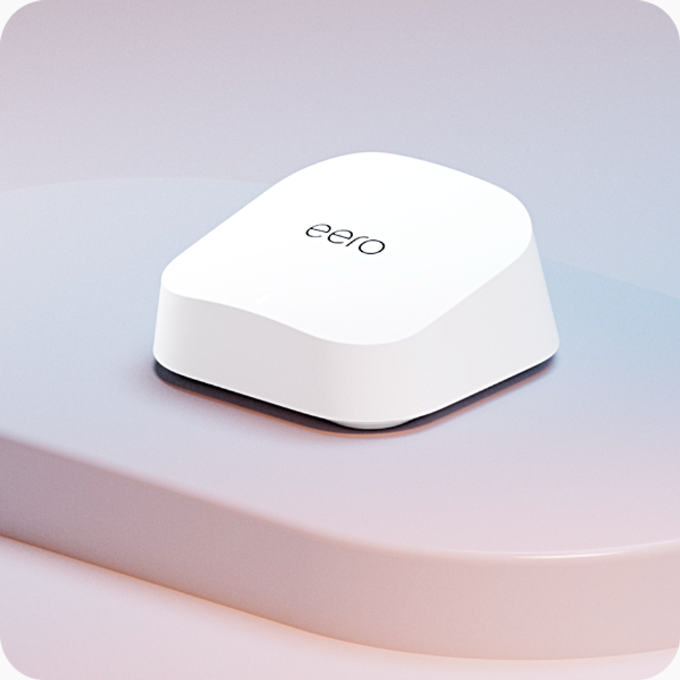 single eero 7 wi-fi router pictured on a colourful platform