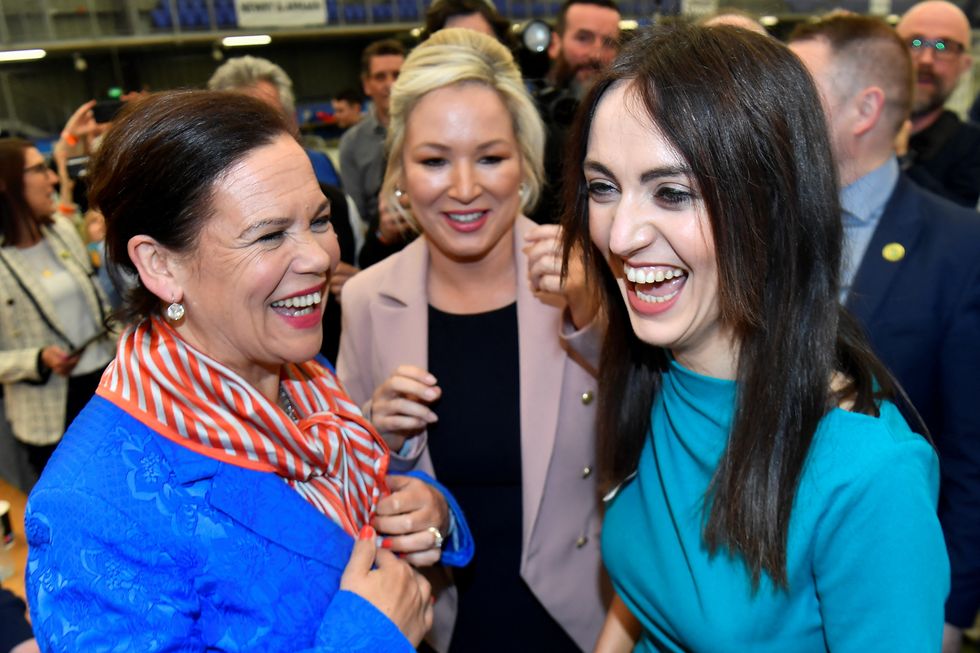 Sinn Fein deputy leader Michelle O'Neill, party leader Mary Louise McDonald and party candidate Emma Sheerin celebrate, after Sinn Fein were voted as the largest party in Northern Ireland, at the Meadowbank Sports Arena count centre, in Magherafelt, Northern Ireland