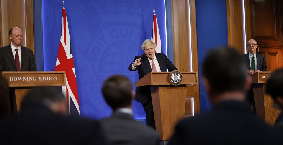 Sir Chris Whitty, Boris Johnson and Sir Patrick Vallance during a media briefing in Downing Street, London. Picture date: Monday February 21, 2022.