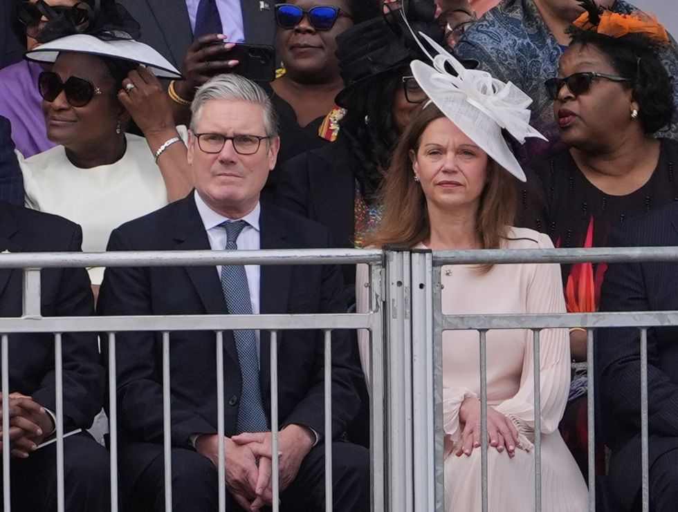 Sir Keir Starmer sat alongaide Victoria Starmer