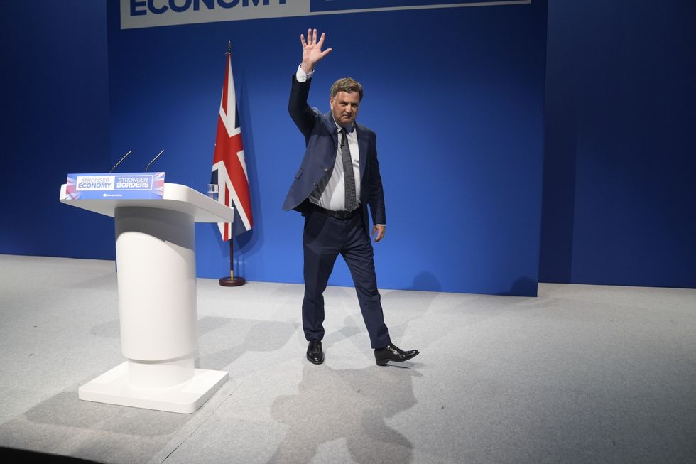 Sir Mel Stride waving to the Tory Party Conference crowd