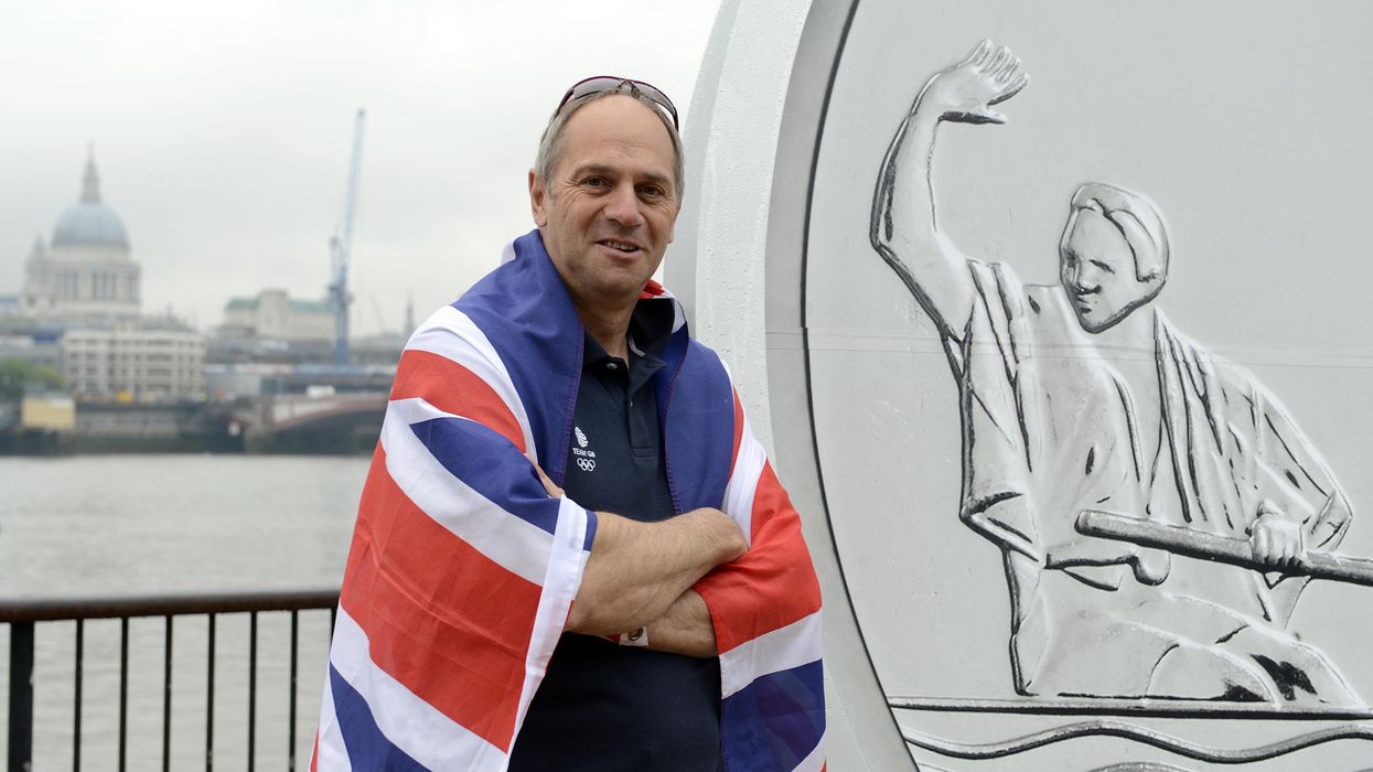Sir Steve Redgrave stands in front of a giant medallion, featuring his face and a Olympic celebratory pose, on the Southbank, London, during the launch of Our Greatest Team Legends Collection