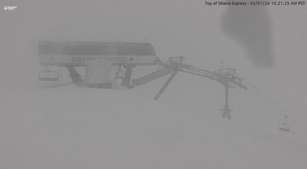 Ski lift in whiteout