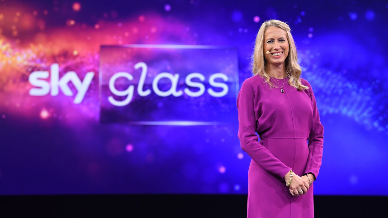 sky ceo dana strong with sky glass logo pictured behind her