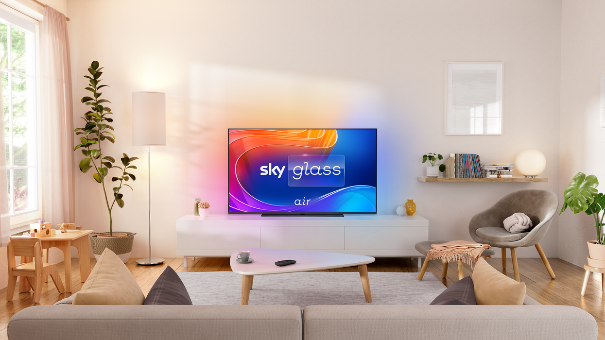 sky glass air pictured in a living room with the screen showing the logo