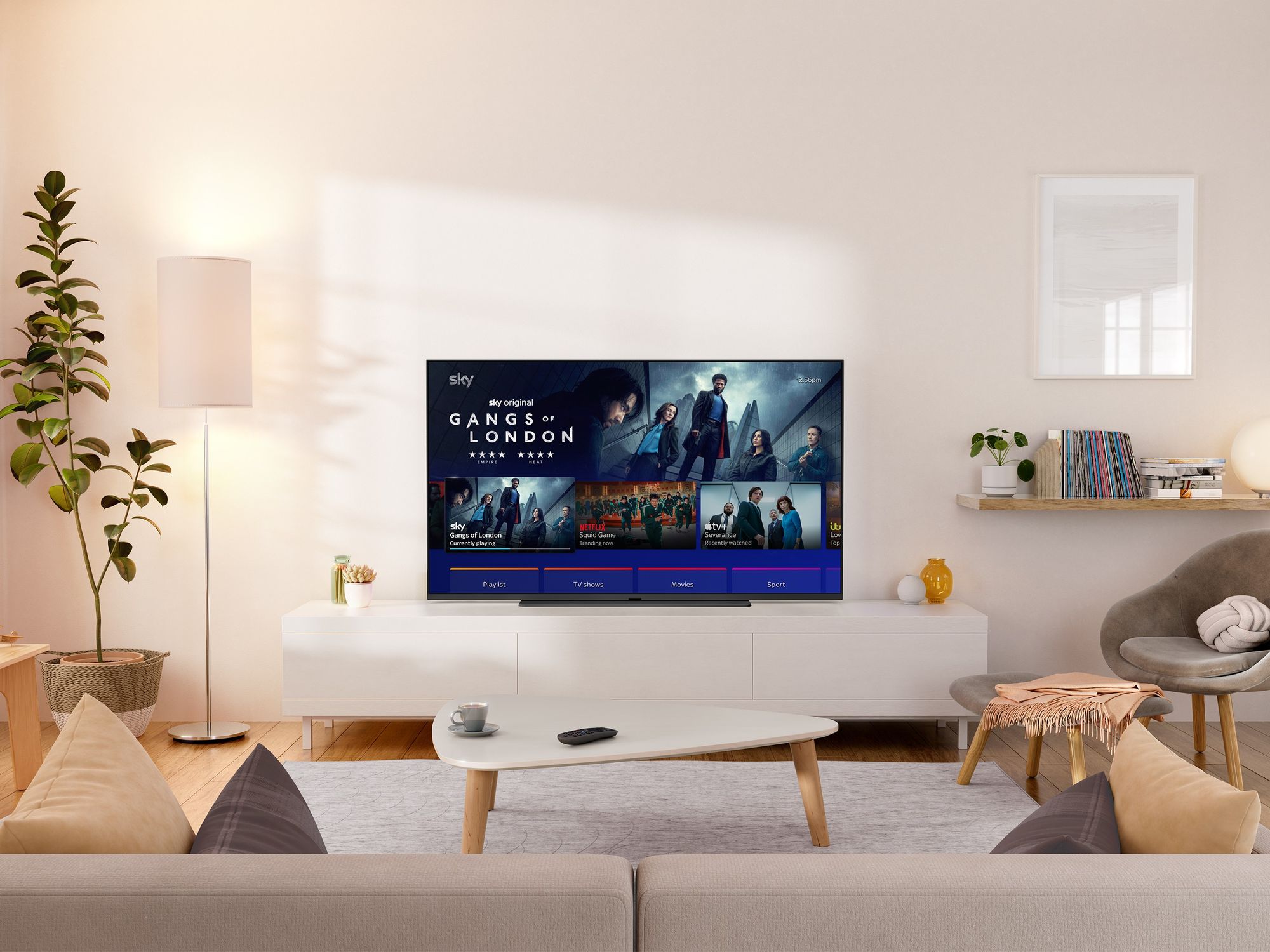 sky glass tv pictured in a living room showing gangs of london on-screen